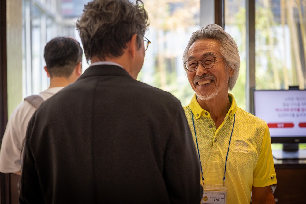Guests greeting at an alumni event